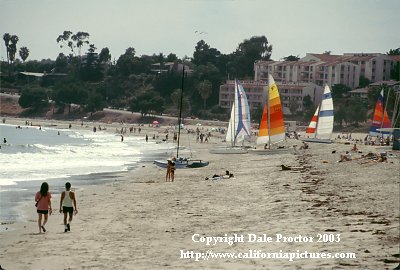 California coast photos Santa Barbara beach man, woman walking on beach, couple
