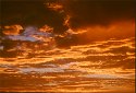 California coast sunset skies clouds glowing gold