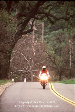 Decker Canyon, Hidden Valley California photos, road curves in scenic area red motorcycle man riding along California coast road in mountain canyon. Pictures of Ventura County State Highway 23