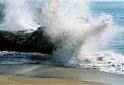 Ocean water spraying over rock sand beaches scenic Southern California Ventura County