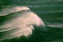 waves travel along coast storm photos El Nino power of water, misting spray, many images in stock library
